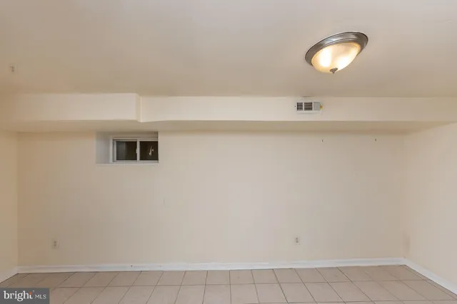 a view of a room with white walls