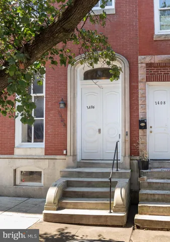 a view of a building with a bench and windows