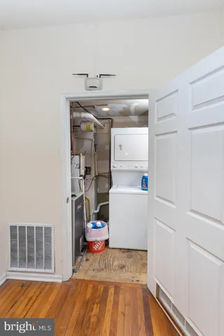 a bed room with a bed window and a flat screen tv