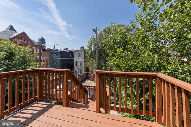a view of balcony with wooden floor