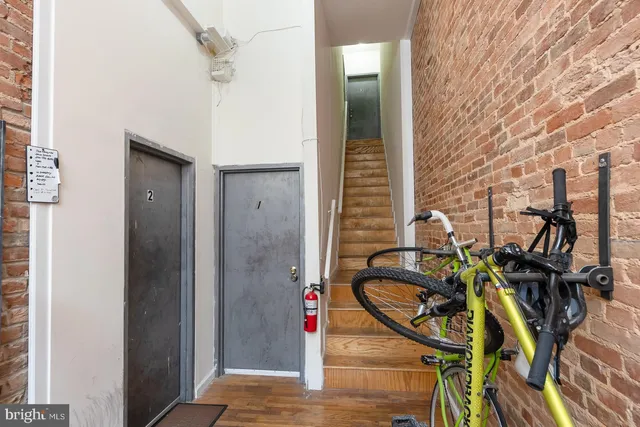 a view of an entryway with wooden door