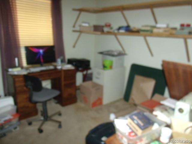 2372 Haskell Way Watkins, CO 80137 - Photo 12 of 17 a room with furniture and a window