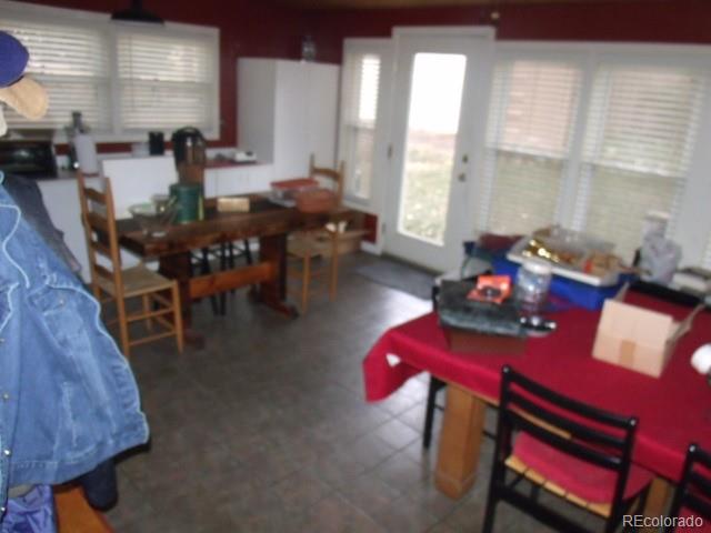 2372 Haskell Way Watkins, CO 80137 - Photo 14 of 17 a view of a dining room with furniture and window