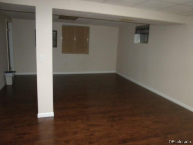 2372 Haskell Way Watkins, CO 80137 - Photo 16 of 17 a view of a small space with wooden floor and a window