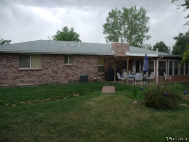 2372 Haskell Way Watkins, CO 80137 - Photo 3 of 17 a view of a house with a yard potted plants and a table