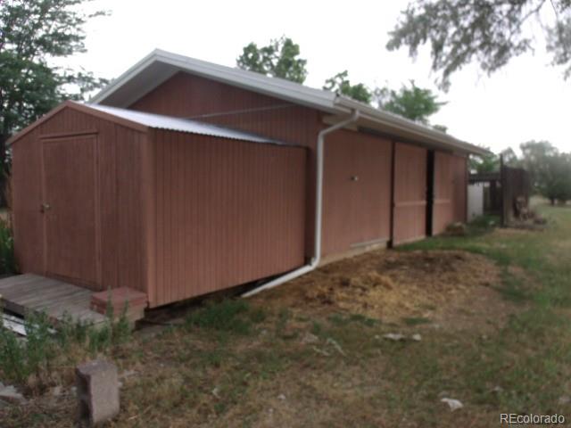 2372 Haskell Way Watkins, CO 80137 - Photo 5 of 17 a backyard of a house with lots of green space