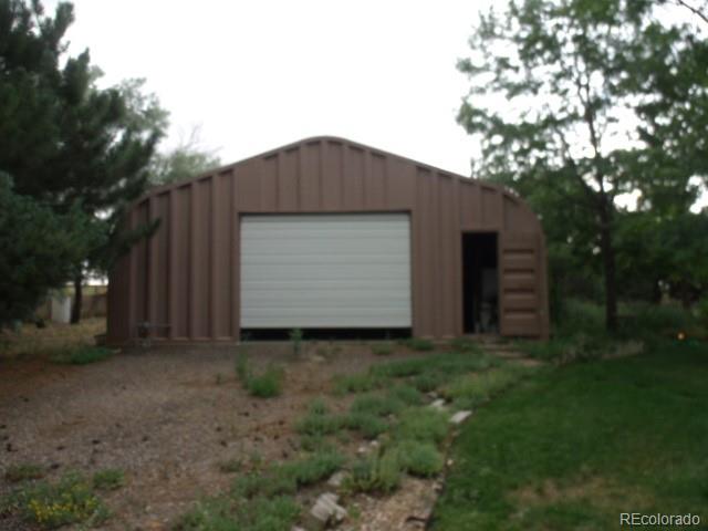 2372 Haskell Way Watkins, CO 80137 - Photo 6 of 17 a backyard of a house with lots of green space