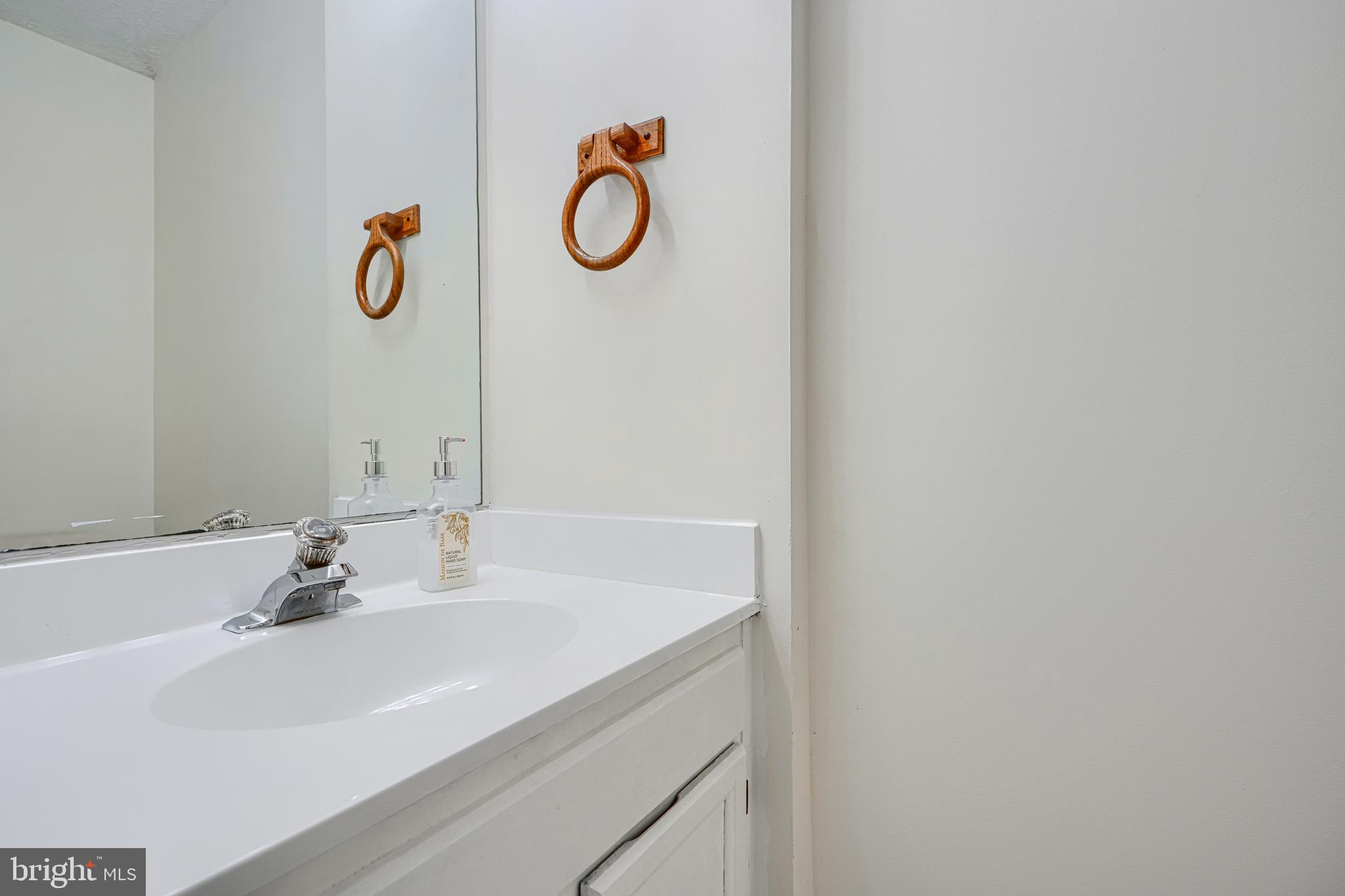 11 Offspring Court Perry Hall, MD 21128 - Photo 13 of 38 a bathroom with a sink and mirror