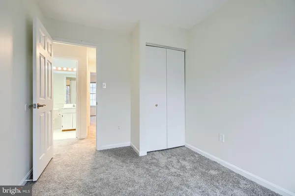 a view of an empty room and a window