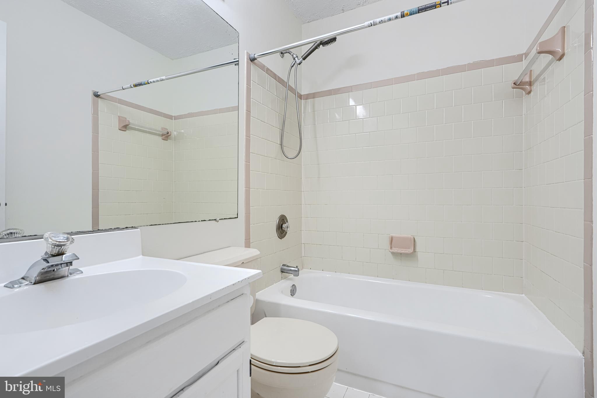 11 Offspring Court Perry Hall, MD 21128 - Photo 24 of 38 a bathroom with a sink a toilet and a bathtub