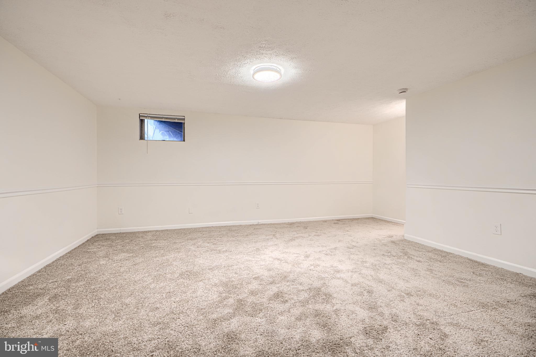 11 Offspring Court Perry Hall, MD 21128 - Photo 28 of 38 an empty room with a workbench