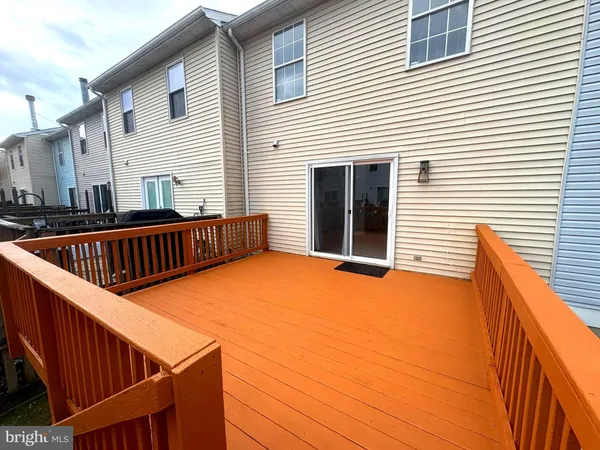 a balcony with chairs and a table