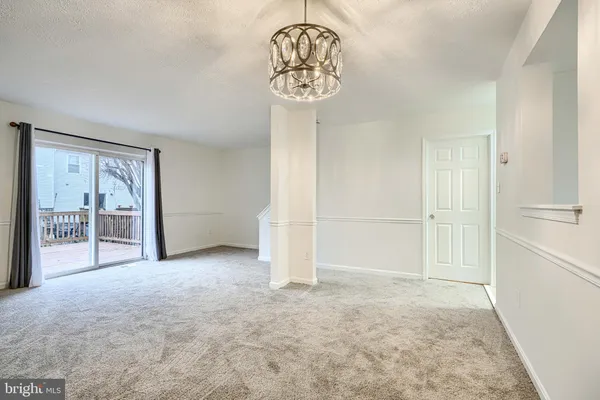 a view of a big room with closet and windows