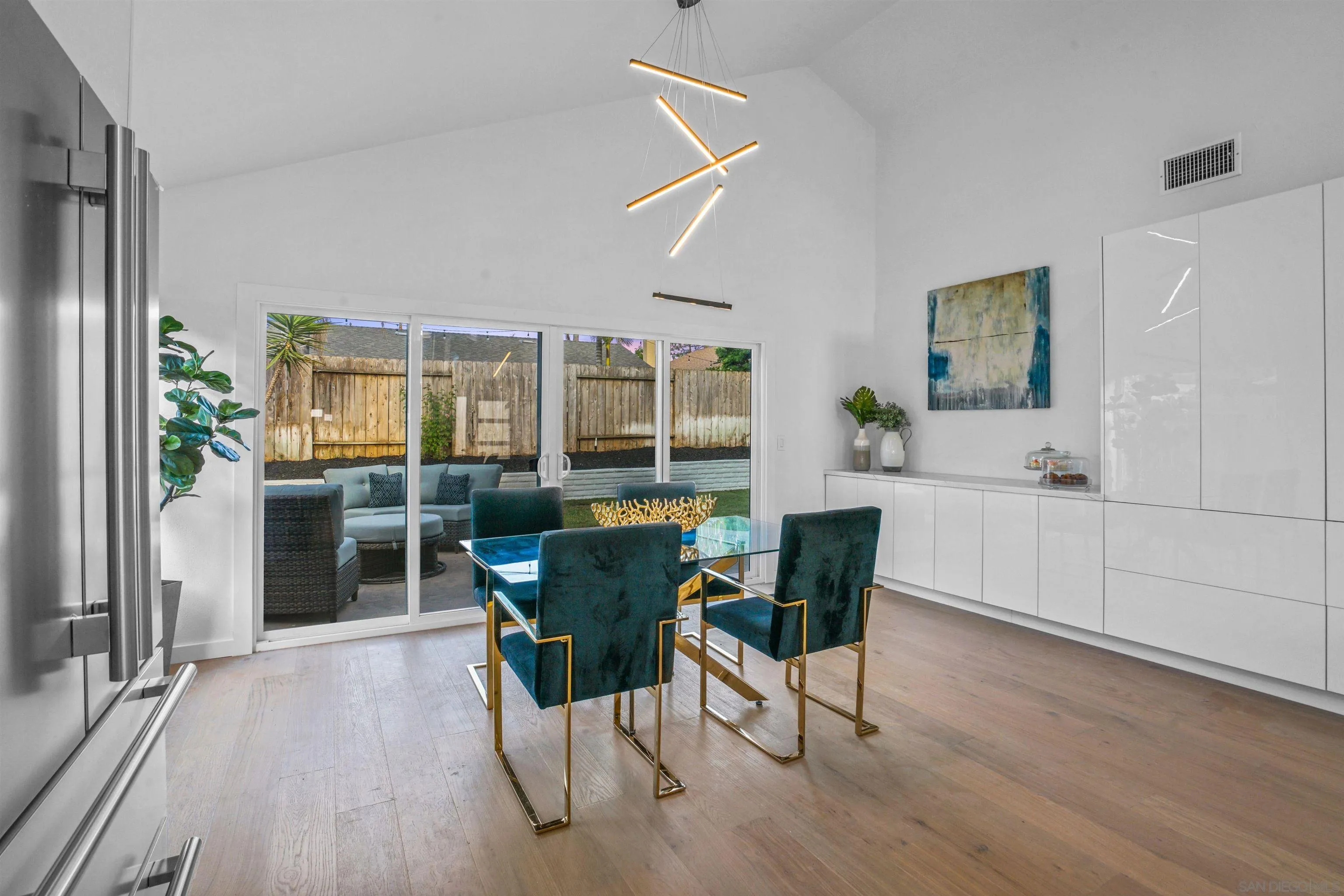 113 Solace Court Encinitas, CA 92024 - Photo 12 of 38 a view of a dining room with furniture and wooden floor