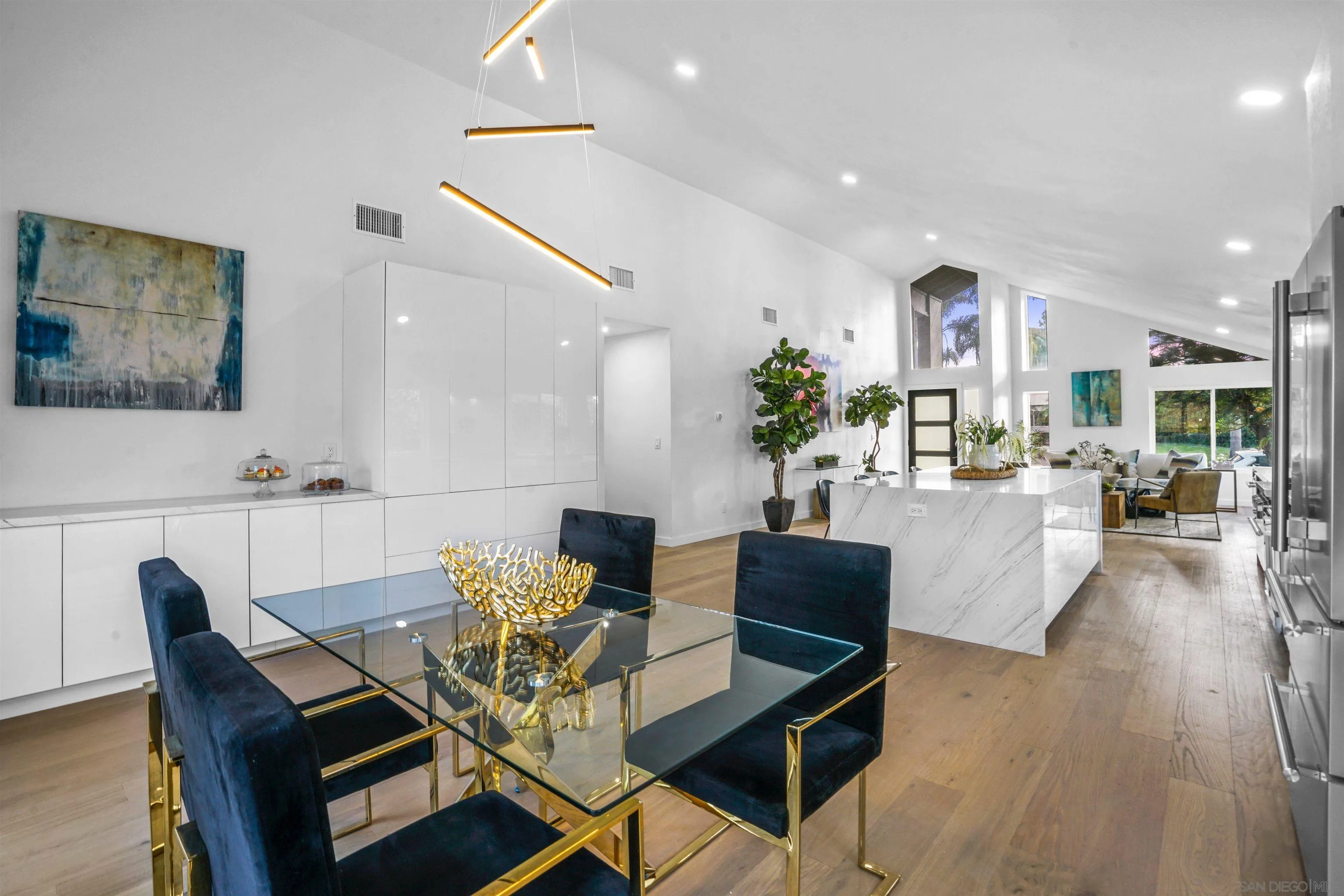 113 Solace Court Encinitas, CA 92024 - Photo 13 of 38 a view of a dining room with furniture and wooden floor