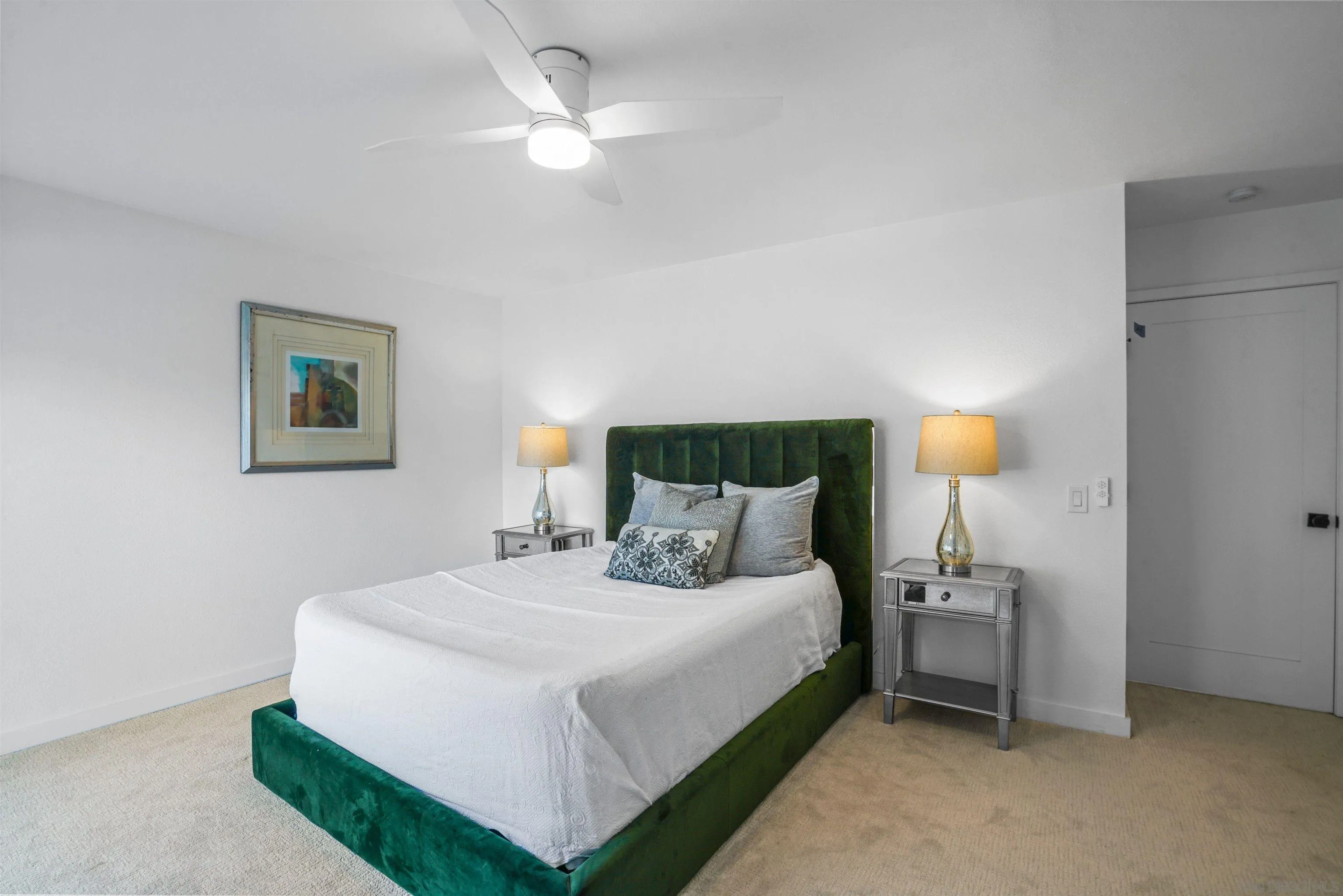 113 Solace Court Encinitas, CA 92024 - Photo 20 of 38 a bedroom with a bed and a chandelier