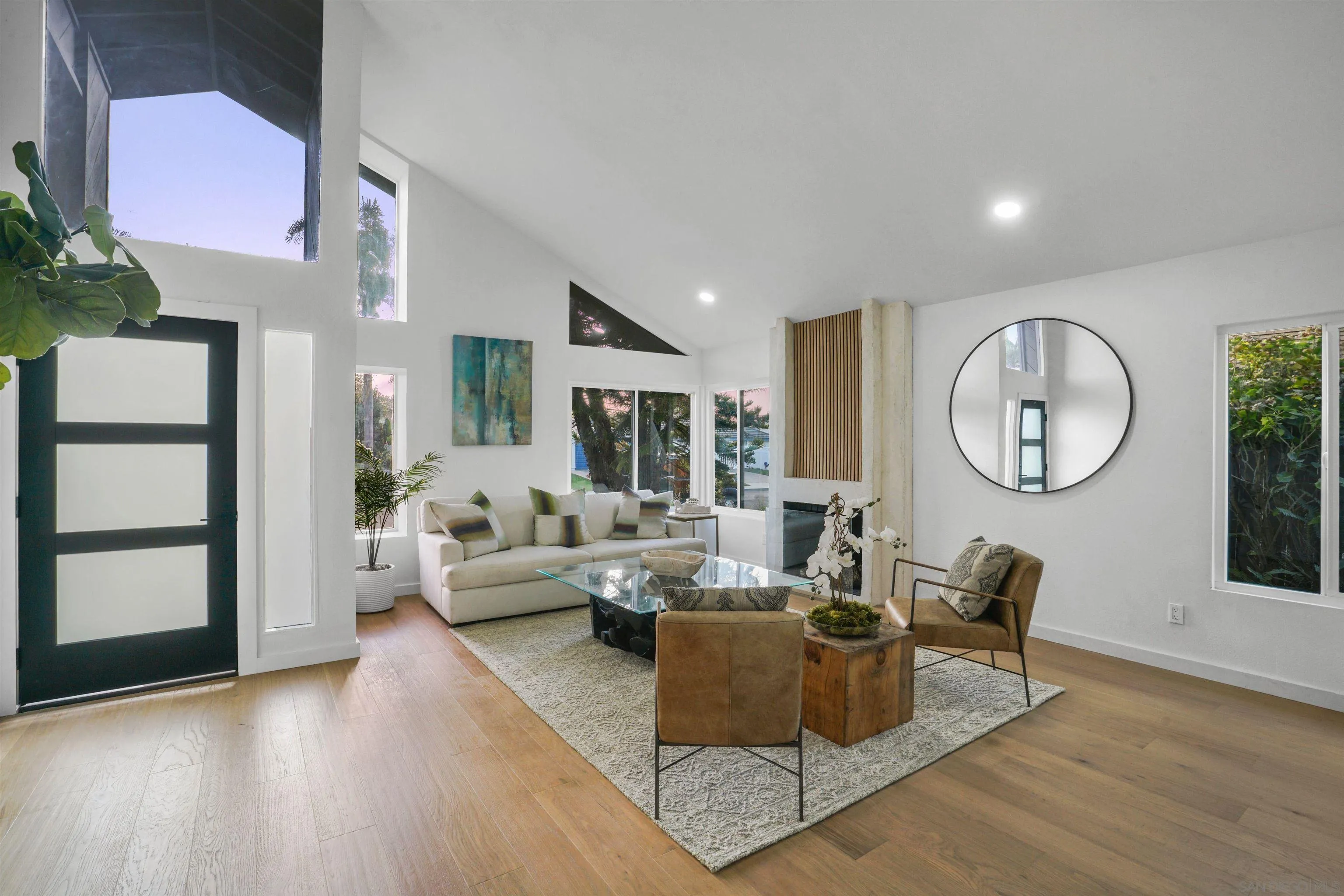 113 Solace Court Encinitas, CA 92024 - Photo 2 of 38 a living room with furniture a mirror and a large window