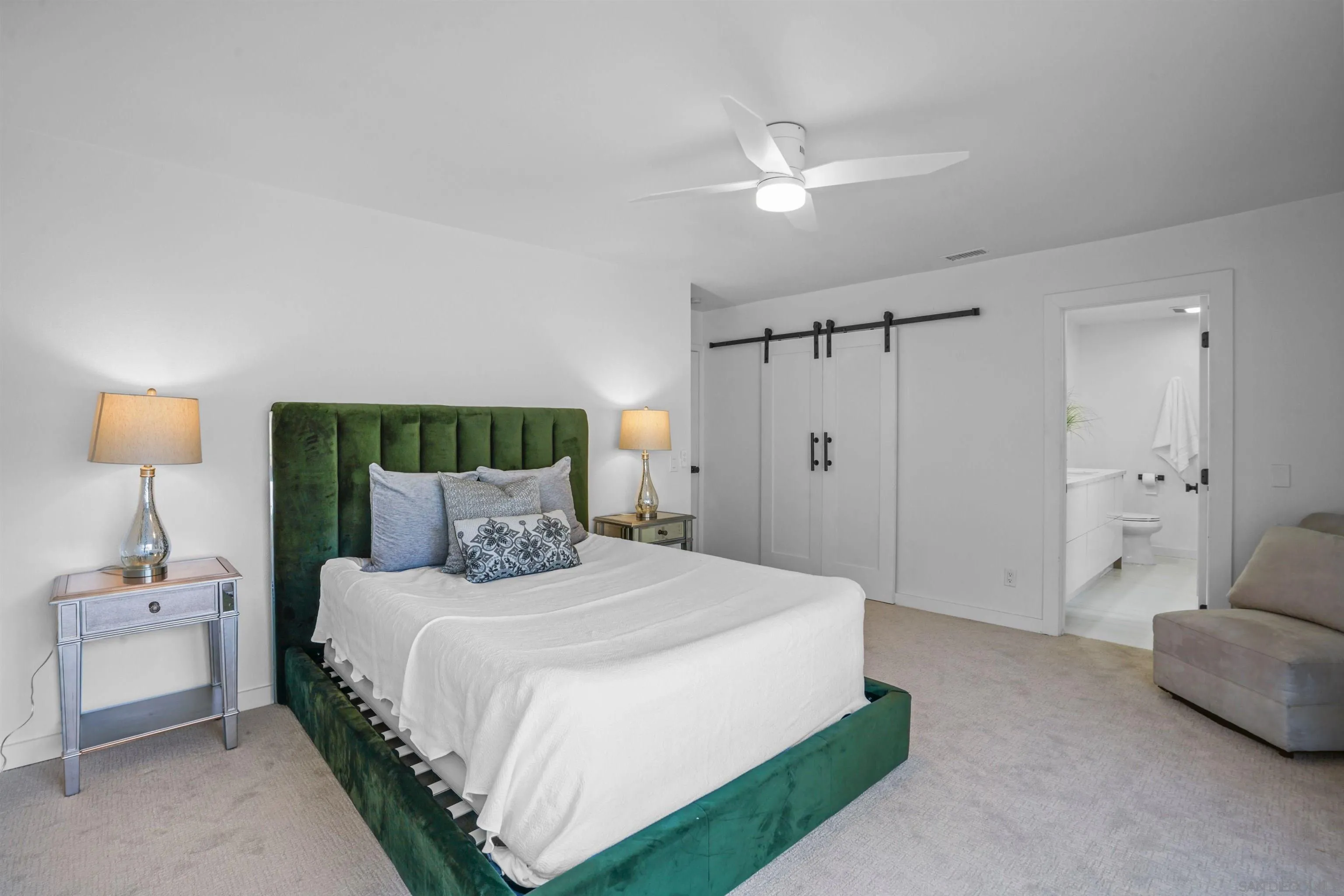 113 Solace Court Encinitas, CA 92024 - Photo 21 of 38 a bedroom with a bed and a lamp