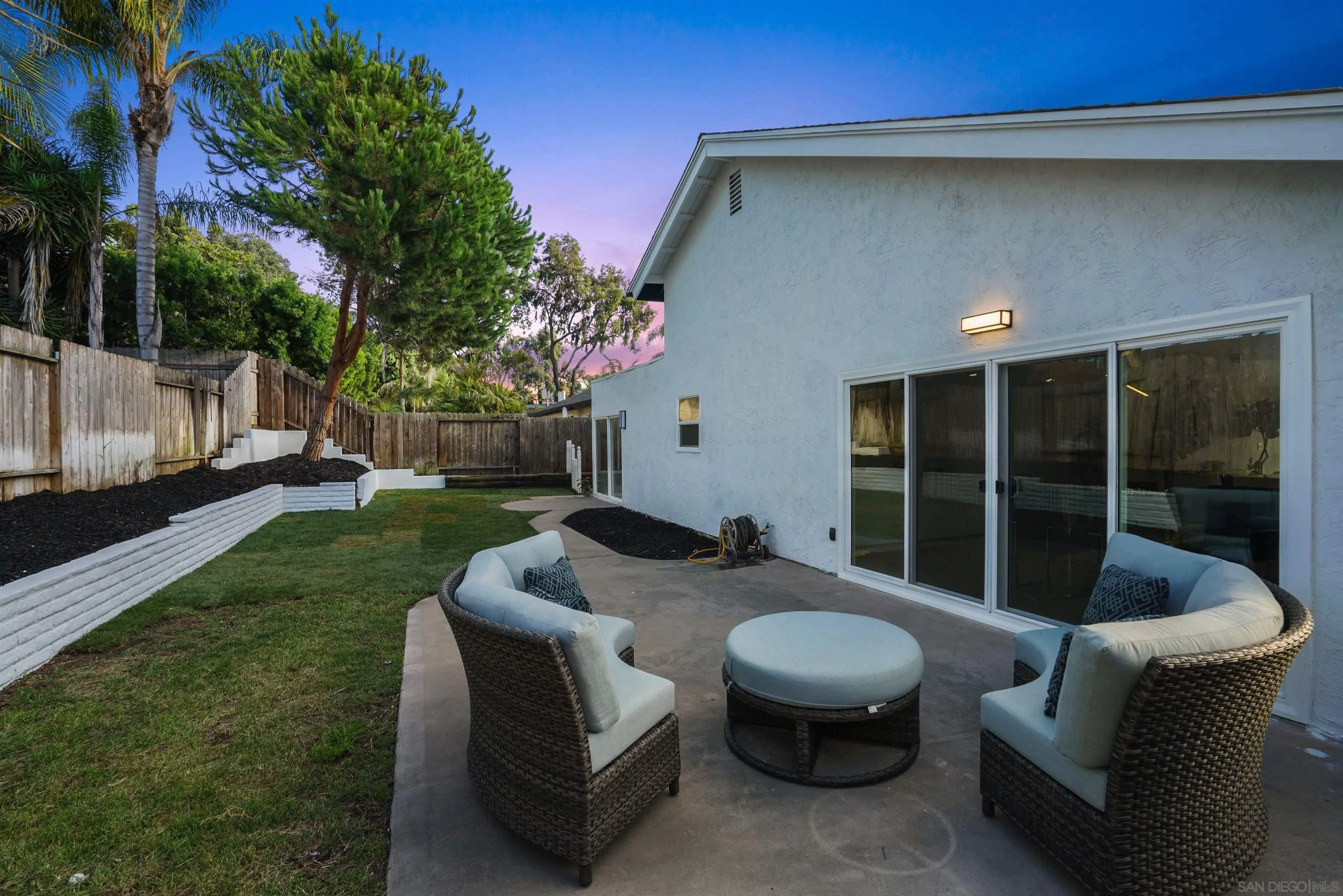 113 Solace Court Encinitas, CA 92024 - Photo 30 of 38 a view of a patio with couches table and chairs and potted plants