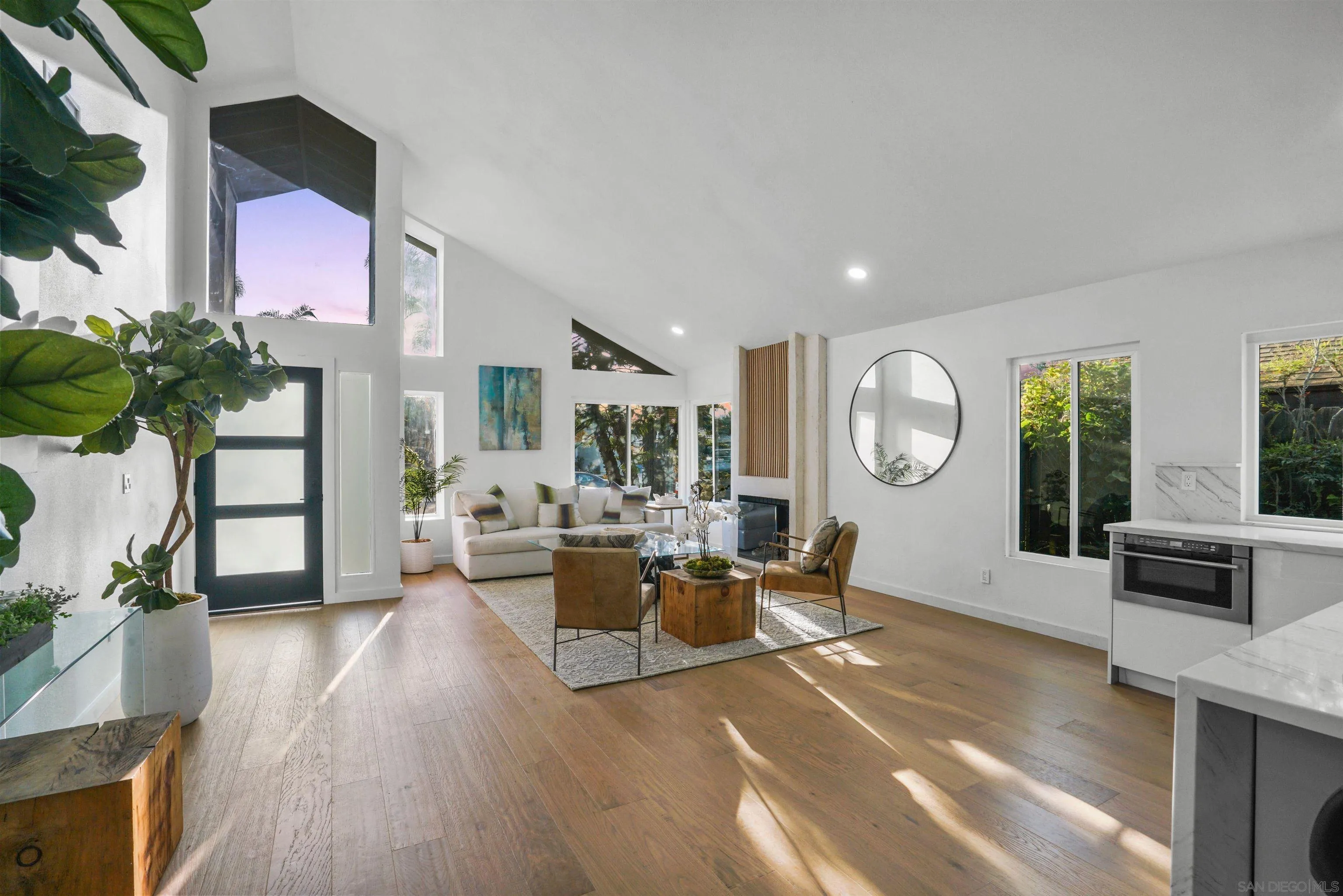 113 Solace Court Encinitas, CA 92024 - Photo 8 of 38 a living room with fireplace furniture and a large window