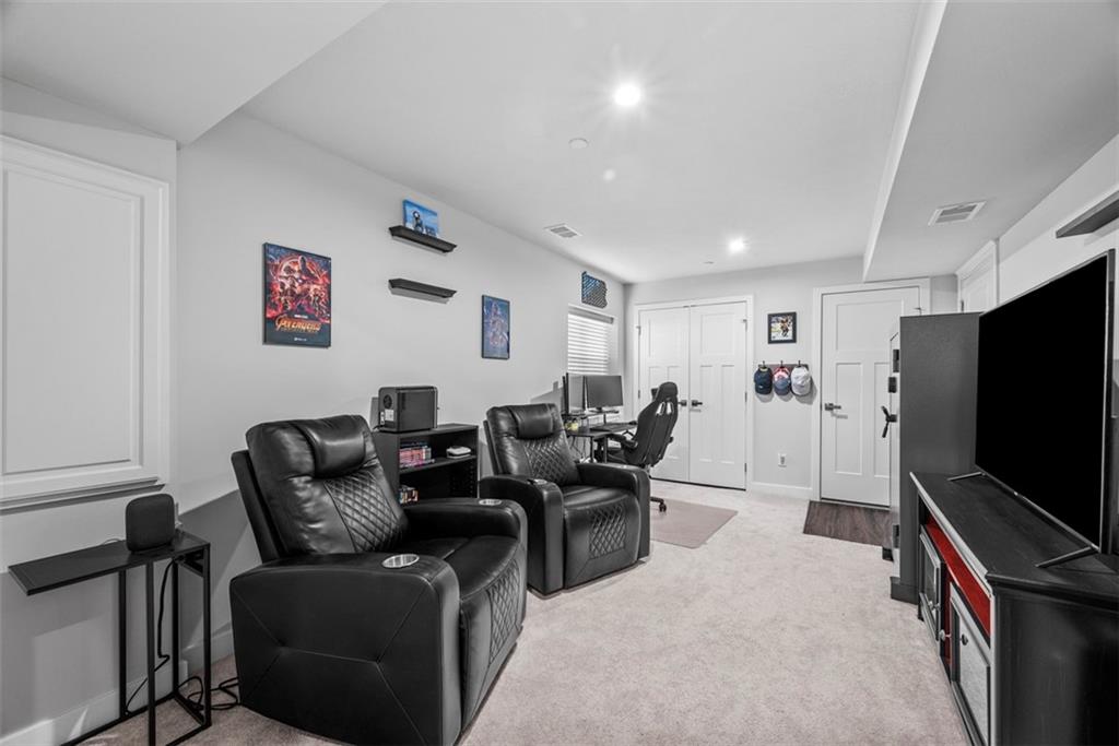 309 Helenium Drive Mars, PA 16046 - Photo 17 of 37 A finished lower level game room is done in soft tones. A window allows natural light to brighten the room.