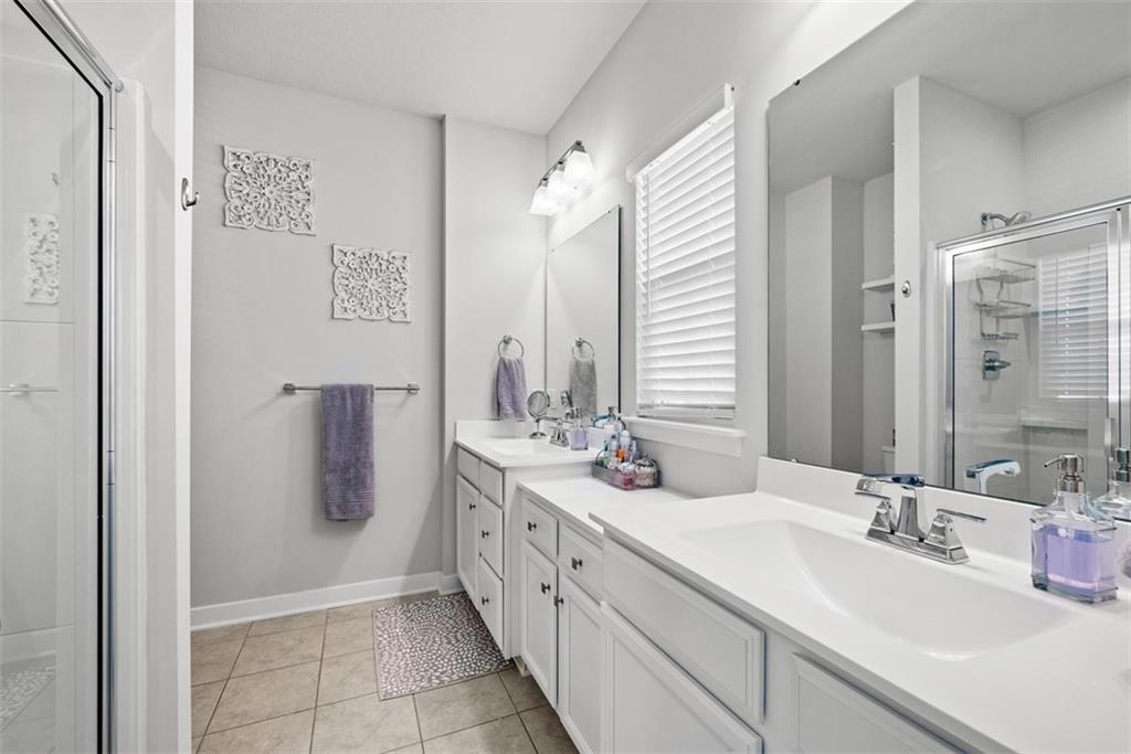 309 Helenium Drive Mars, PA 16046 - Photo 22 of 37 Start your day in this spacious master bathroom with dual vanities and additional vanity space. Tile flooring is appreciated.