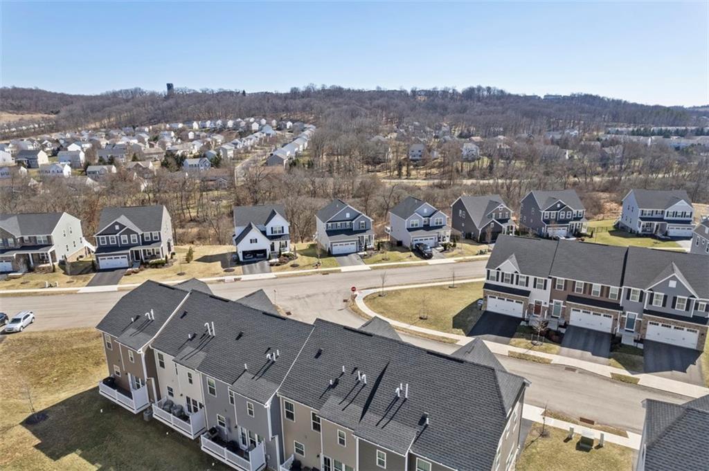 309 Helenium Drive Mars, PA 16046 - Photo 34 of 37 An aerial view shows the mix of single family homes and townhouse designs in the community. Sidewalks allow safe walks throughout the community.