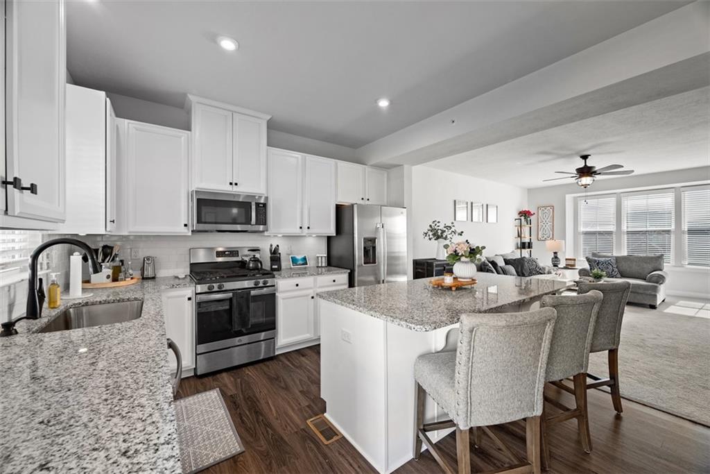 309 Helenium Drive Mars, PA 16046 - Photo 6 of 37 Stainless steel appliances and recessing lighting are additional benefits to the kitchen space.