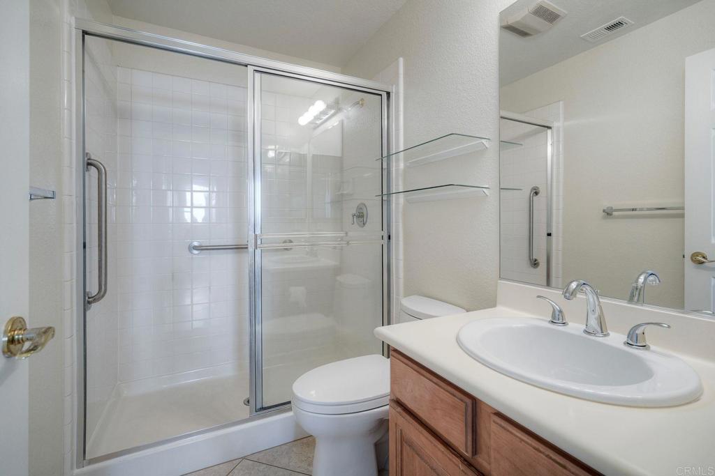 2914 Rancho Rio Chico Carlsbad, CA 92009 - Photo 12 of 37 a bathroom with a sink toilet and shower