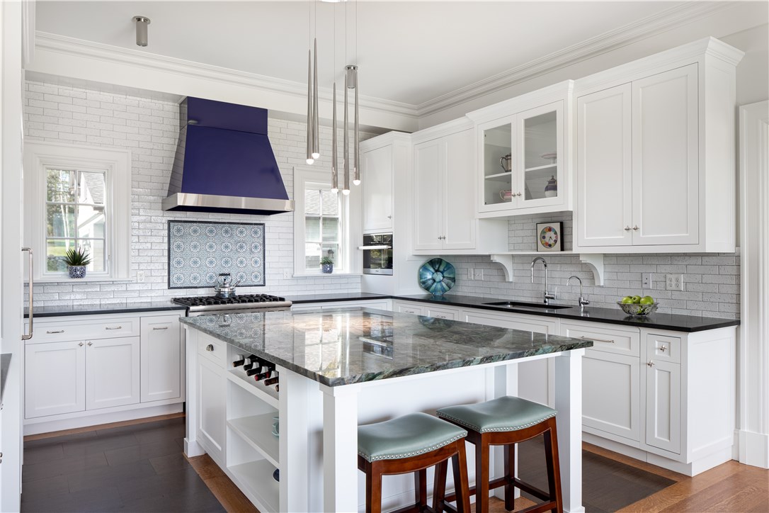 415 Poppasquash Road Bristol, RI 02809 - Photo 13 of 50 The kitchen is equipped with Sub-zero, Viking and Miele appliances, custom rare stone counter-tops, oak floors with a cork inlet.