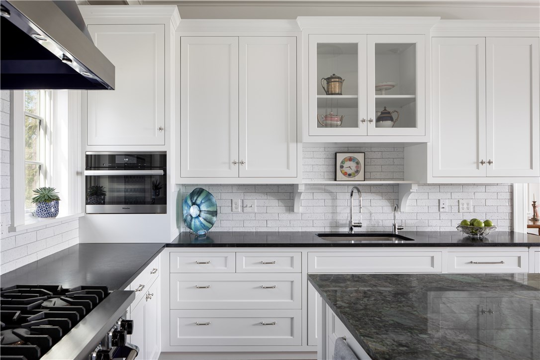 415 Poppasquash Road Bristol, RI 02809 - Photo 15 of 50 Soapstone counter-tops along the perimeter with Miele oven and Viking range.