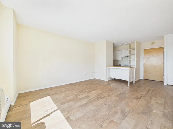 a view of kitchen with white cabinets