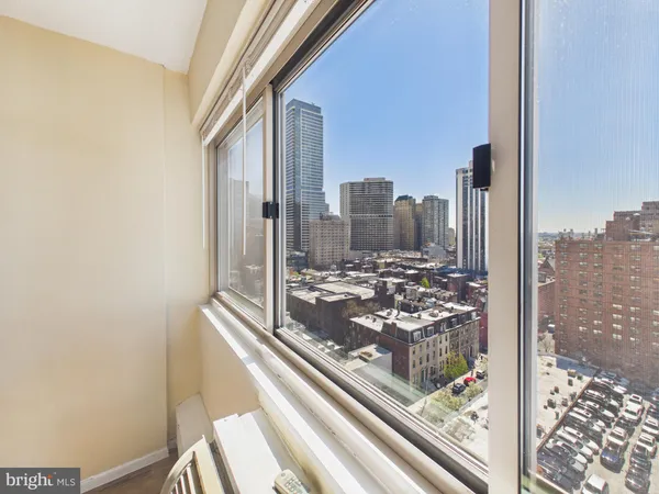 a view of a city from a hallway