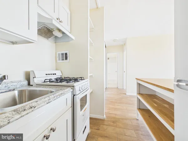 a kitchen with a stove and a sink