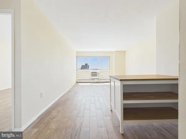 a view of kitchen and wooden floor