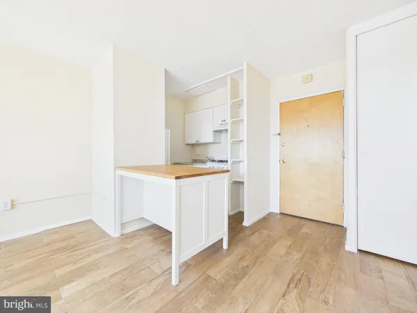 a view of kitchen with wooden floor