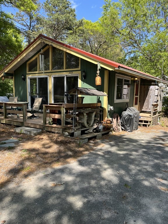 359 Cotuit Road Mashpee, MA 02649 - Photo 2 of 2 a view of a house with backyard