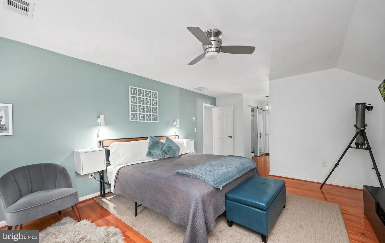 18505 Cabin Road Triangle, VA 22172 - Photo 19 of 40 a bedroom with a bed and wooden floor