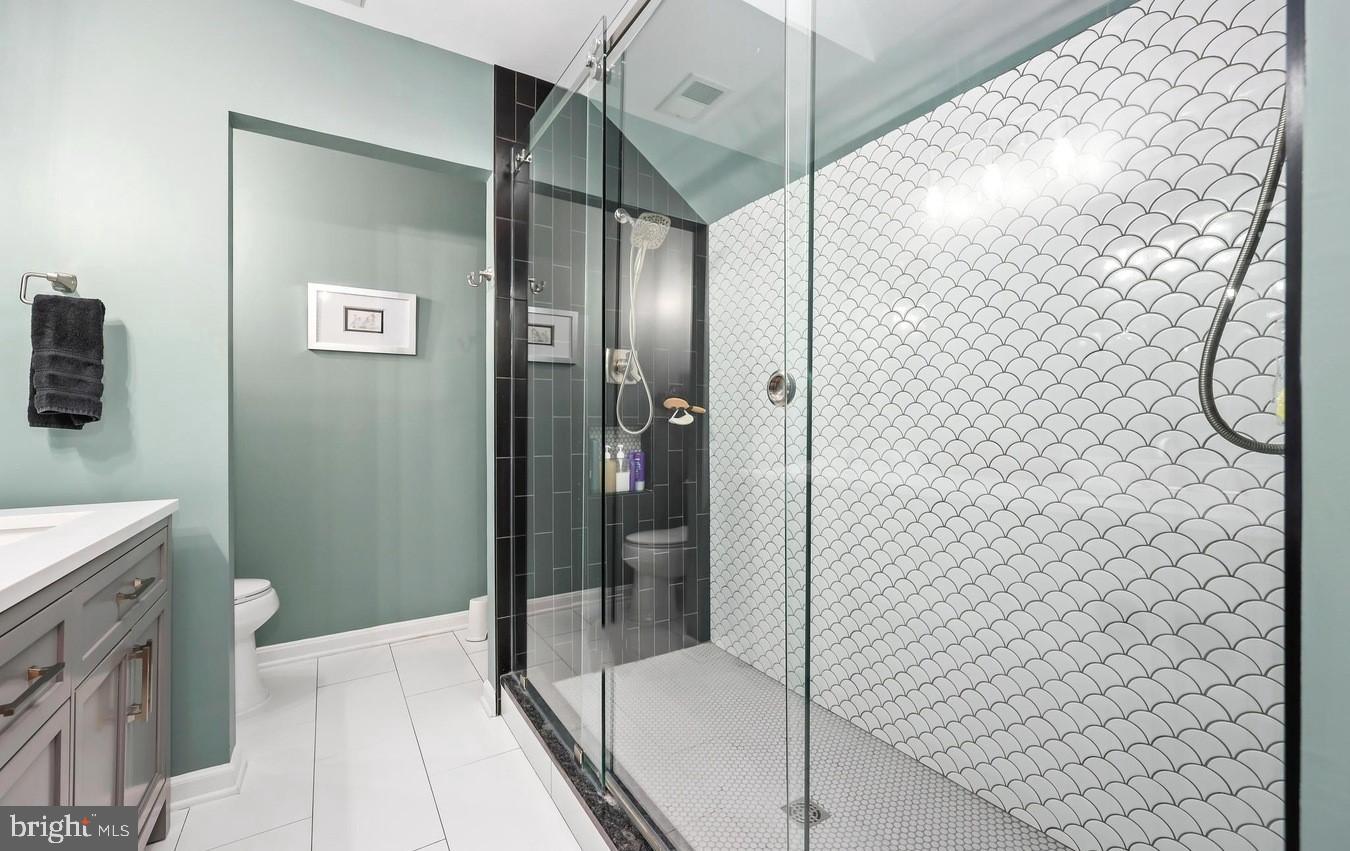 18505 Cabin Road Triangle, VA 22172 - Photo 21 of 40 a bathroom with a shower and a sink