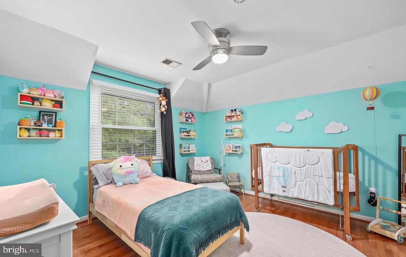 18505 Cabin Road Triangle, VA 22172 - Photo 24 of 40 a bedroom with a bed a window and dresser