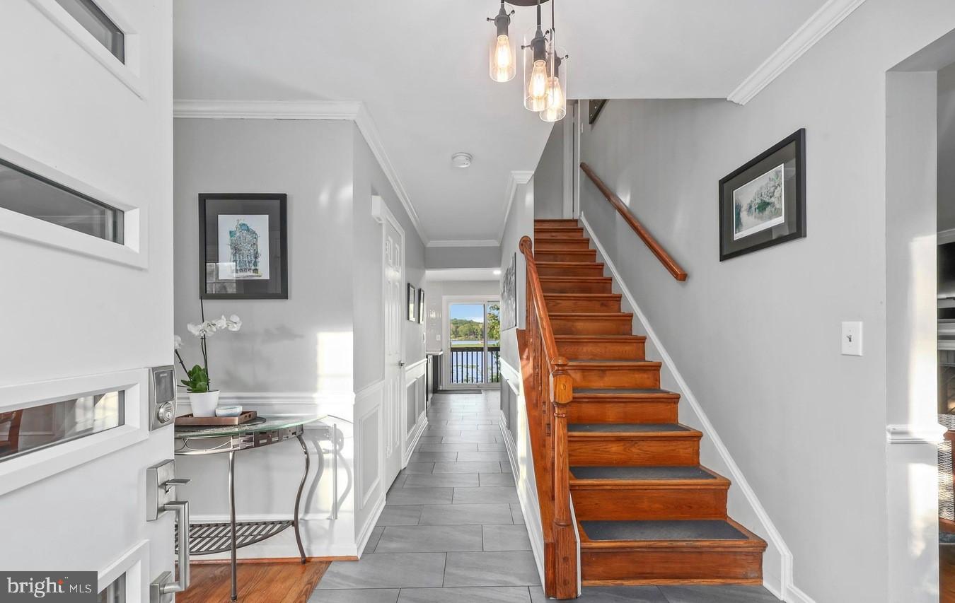 18505 Cabin Road Triangle, VA 22172 - Photo 6 of 40 a view of a hallway with furniture and staircase