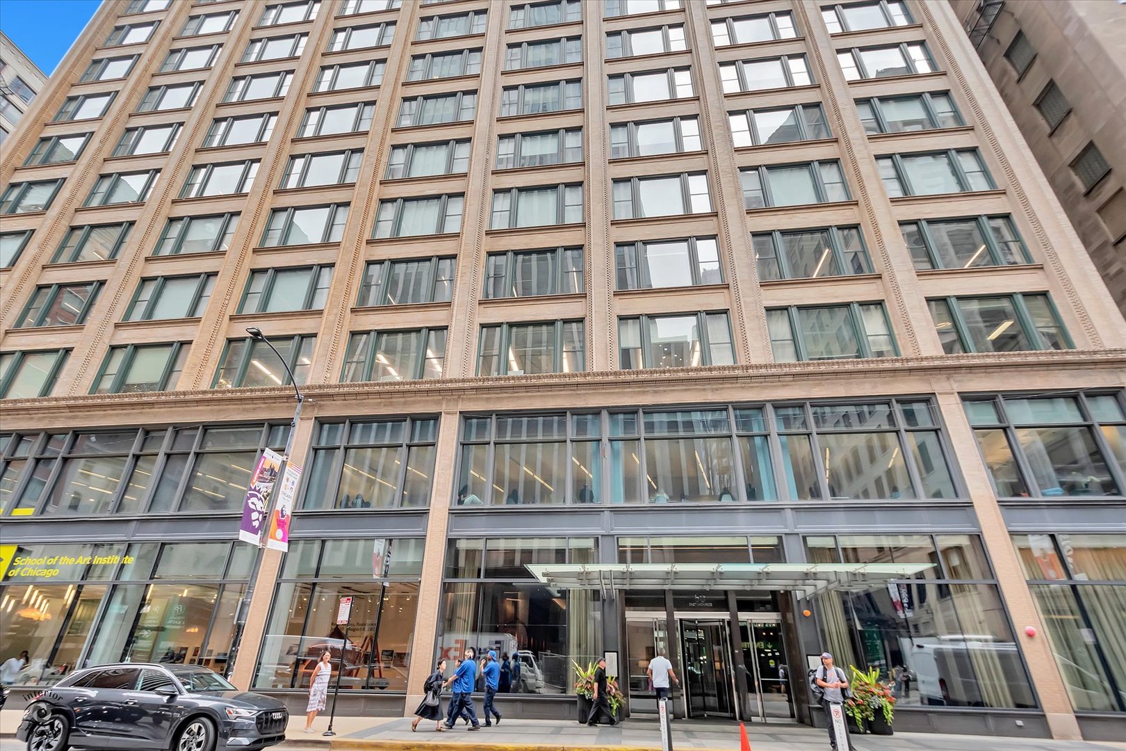 a front view of a building with parking space