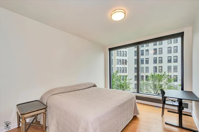 a bedroom with furniture and a window