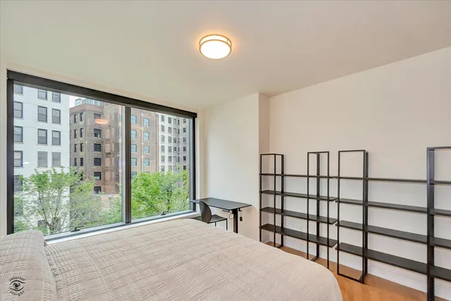 a bathroom with a large tub sink shower and double