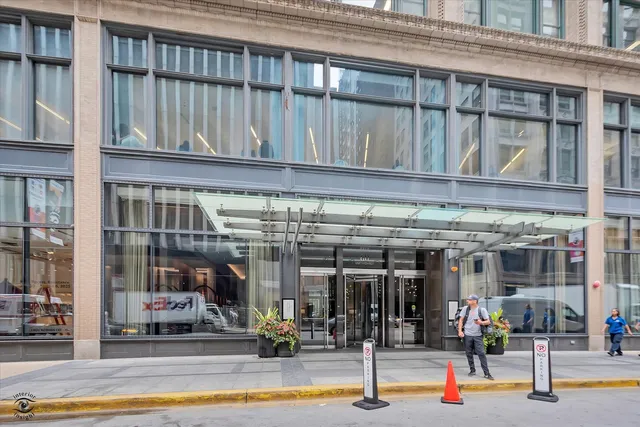 a view of building with glass door and door