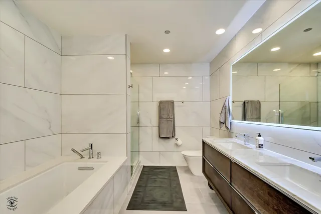a bathroom with a shower and a glass door
