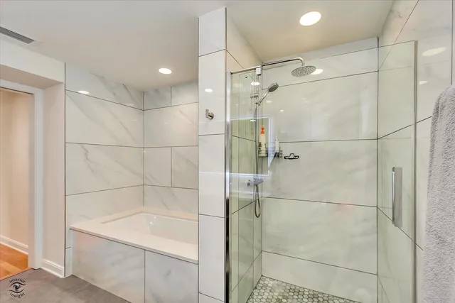 a view of a workspace with furniture and wooden floor