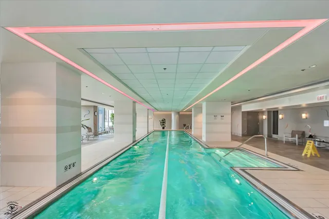 a view of outdoor space with patio swimming pool and outdoor seating