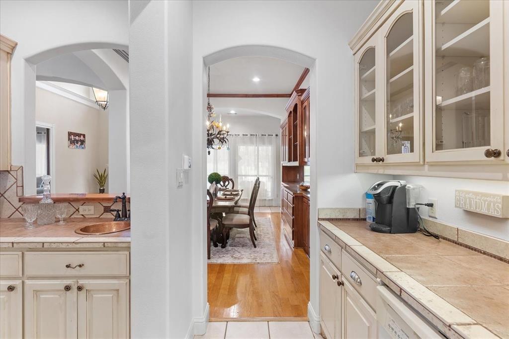 117 Redtail Court Weatherford, TX 76088 - Photo 11 of 39 a kitchen with a sink and cabinets