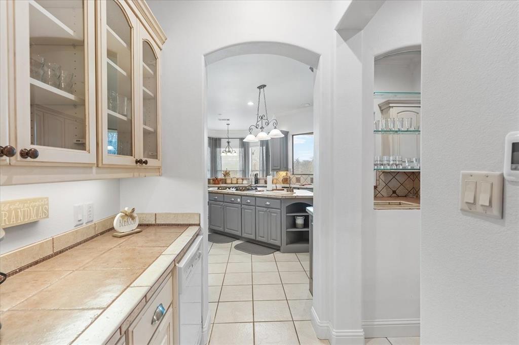 117 Redtail Court Weatherford, TX 76088 - Photo 13 of 39 a kitchen with a sink and cabinets